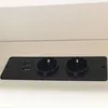 A black electrical outlet strip with two USB ports and two power outlets, mounted on a white surface. Podgląd zdjęcia produktu