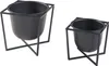 Two black metal plant stands with pots, shown against a white background. Náhled obrázku produktu