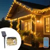 A house decorated with solar-powered LED string lights at night. Náhled obrázku produktu