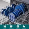 A dishwasher rack filled with blue ceramic plates and bowls. Voir les images du produit