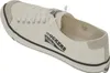 A single white canvas sneaker is shown from a side-diagonal angle against a white background. Voir les images du produit