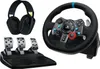 A gaming steering wheel, pedals, and headset are displayed against a white background. Náhled obrázku produktu