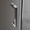 A close-up of a modern shower door handle. Voir les images du produit