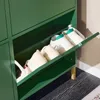 A close-up view of a dark green shoe cabinet with several pairs of shoes stored inside. Náhľad obrázku produktu
