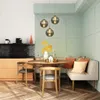 A dining area with a round table, chairs, and a banquette seating area. Produktbild-Vorschau