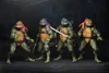 Four Teenage Mutant Ninja Turtle action figures standing in a dark, gritty environment. Produktbild-Vorschau
