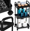 A black rolling cart with multiple shelves filled with bath products and toilet paper. Anteprima dell’immagine prodotto