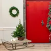 A Christmas-themed outdoor decoration scene with a red door, a wreath, a small Christmas tree on a sled, and candles. Podgląd zdjęcia produktu