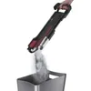 A hand holding a vacuum cleaner, emptying dust into a bin. Produktbild-Vorschau
