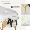 Close-up of a white massage table with a headrest and armrest, with marketing text and diagrams on the right side. Náhled obrázku produktu
