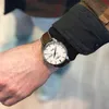 A close-up shot of a person's wrist wearing a watch. Náhľad obrázku produktu