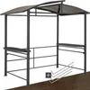 A dark gray grill pavilion with a curved, translucent brown roof, featuring two built-in shelves and a metal frame. Several L-shaped metal stakes are shown in the foreground, along with a plus symbol icon. Produktbild-Vorschau
