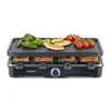 A Severin raclette grill is shown with food cooking on it, including chicken, vegetables, and tomatoes. Several raclette pans are visible underneath the grill plate. Voir les images du produit
