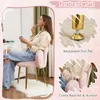 A woman is applying makeup while sitting on a pink velvet chair with gold legs. The image also shows close-ups of the chair's adjustable footpad and backrest. Náhľad obrázku produktu