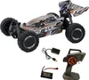 A remote-controlled buggy and its accessories are displayed against a white background. Voir les images du produit