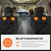 View from inside a car looking forward, showing a dog seat cover installed on the back seats. Produktbild-Vorschau