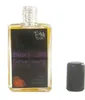 A perfume bottle with its cap off, placed next to it. Produktbild-Vorschau