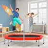 Two children are joyfully jumping on a red trampoline in a brightly decorated room with a rocket mural on the wall. Anteprima dell’immagine prodotto