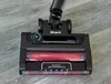 Close-up of a vacuum cleaner head on a wooden floor. Produktbild-Vorschau