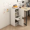 A white cabinet with open doors and drawers, placed next to a desk with a laptop and lamp. Náhled obrázku produktu