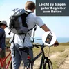 Two people with bicycles on a path near the sea, with a portable air compressor highlighted. Produktbild-Vorschau