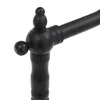 A close-up of a black faucet handle and spout. Podgląd zdjęcia produktu