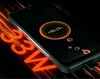 A smartphone is shown charging with a glowing battery indicator on its screen. The text "33W" is prominently displayed in an orange, glowing font, suggesting fast charging capabilities. Anteprima dell’immagine prodotto