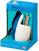 A ceramic shark-shaped pen holder is displayed inside its blue retail packaging. Podgląd zdjęcia produktu