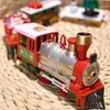 A festive toy train set, possibly for Christmas decoration, is displayed on a woven mat. Náhľad obrázku produktu