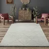 A living room scene with a rug, chairs, and decorative items. Produktbild-Vorschau