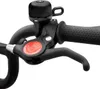A close-up view of a bicycle handlebar with a bell and brake lever. Produktbild-Vorschau