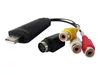 A black USB video grabber with S-Video and RCA connectors against a white background. Náhled obrázku produktu