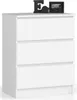 A white chest of drawers with three drawers, shown from the front-left angle. Decorative items, a letter 'E' and a framed picture, are placed on top of the dresser. Produktbild-Vorschau