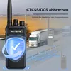 A marketing image showing a walkie-talkie with overlaid text and graphics, set against a background of trucks on a highway. Voir les images du produit