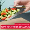 A hand holding a stainless steel scoop filled with chopped cucumbers and red peppers over a wooden surface. Produktbild-Vorschau