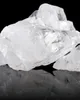 A close-up of a pile of clear, crystalline material against a black background, with its reflection visible below. Produktbild-Vorschau