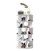 A white rotating shoe rack filled with various shoes, with decorative items on the top shelf. Podgląd zdjęcia produktu
