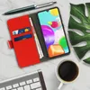 A red flip-cover phone case with card slots, a smartphone, a pen, a coffee cup, a keyboard, and a leaf on a marble-patterned surface. Produktbild-Vorschau