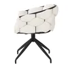 A beige upholstered chair with black metal legs, shown from the side against a white background. Produktbild-Vorschau