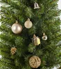 A close-up view of a decorated Christmas tree with various ornaments. Náhled obrázku produktu