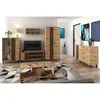 A living room scene featuring a furniture set including a tall cabinet, a TV stand with a television, a bookshelf, and a coffee table, all in a loft style with oak artisan finish. Produktbild-Vorschau