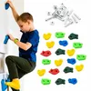 A young boy is climbing on a wall with climbing holds, and a set of climbing holds and hardware is displayed separately. Podgląd zdjęcia produktu