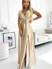 A woman is posing in a room wearing a gold dress. Produktbild-Vorschau