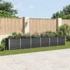 A raised garden bed filled with plants is situated in a garden setting with a wooden fence and paved patio. Náhľad obrázku produktu