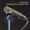 Close-up of a faucet with water flowing, highlighting air induction technology. Produktbild-Vorschau