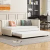 A beige daybed with an extended trundle bed is shown in a living room setting. Podgląd zdjęcia produktu