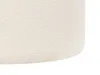 A close-up view of the textured fabric of a round pouf. Náhled obrázku produktu