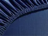 A close-up view of a dark blue fitted sheet, showing the elasticized edge. Produktbild-Vorschau