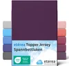 A stack of folded fitted sheets in various colors, with the main product in a deep purple color prominently displayed. Náhled obrázku produktu