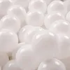 A close-up, overhead view of many white balls. Produktbild-Vorschau